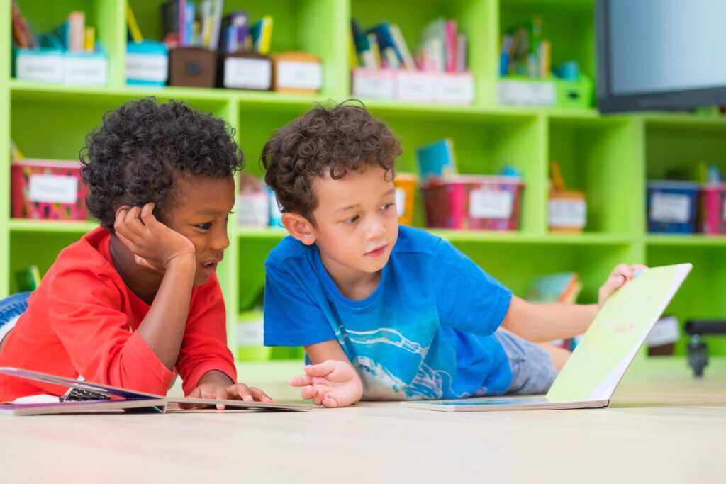 Two Young Children Sitting Closely Together